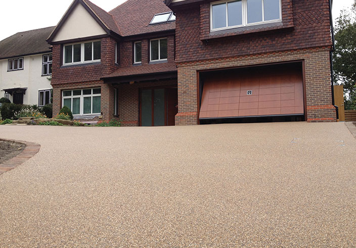 Resin Bound Gravel Driveway in Flaxen Pea colour, Reigate, Surrey installed by Clearstone