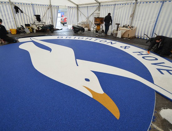 Martin Perry checking Clearstone’s resin bound Albion Seagull logo - Amex Community Stadium Brighton