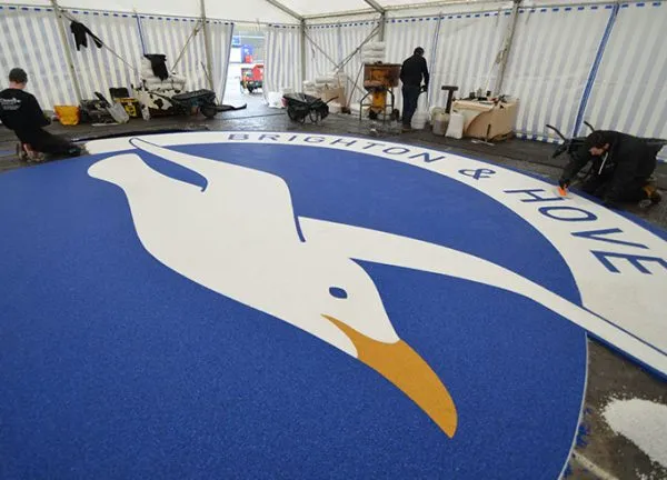 Martin Perry checking Clearstone’s resin bound Albion Seagull logo - Amex Community Stadium Brighton