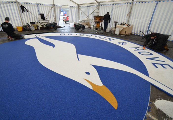 Martin Perry checking Clearstone’s resin bound Albion Seagull logo - Amex Community Stadium Brighton