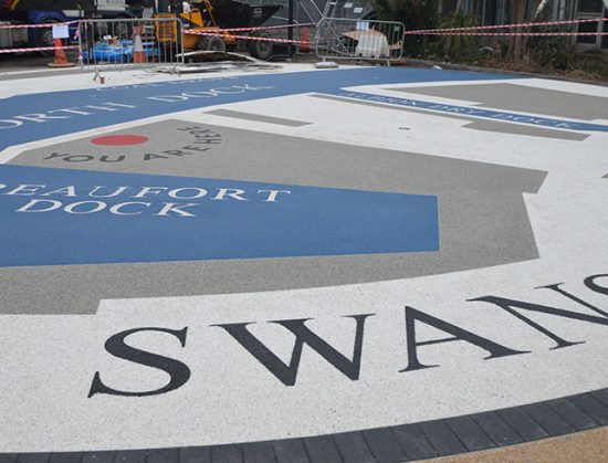 Resin bound colour way-finding dock side graphic, Parc Tawe retail park Swansea