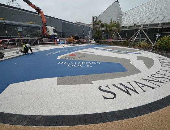 Resin bound colour way-finding dock side graphic, Parc Tawe retail park Swansea