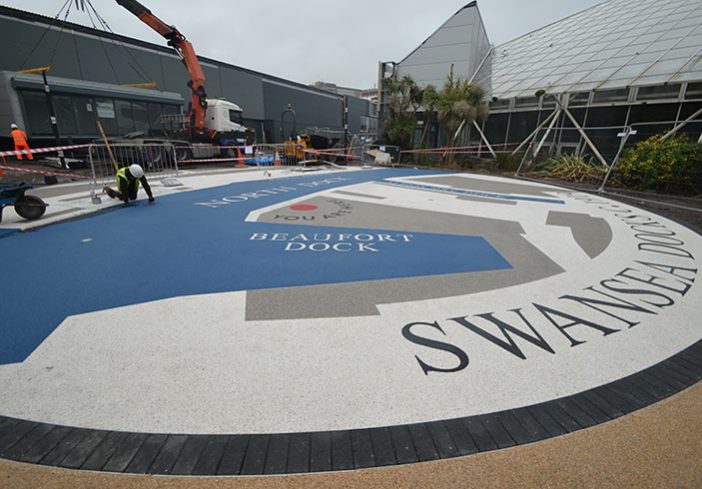 Resin bound colour way-finding dock side graphic, Parc Tawe retail park Swansea