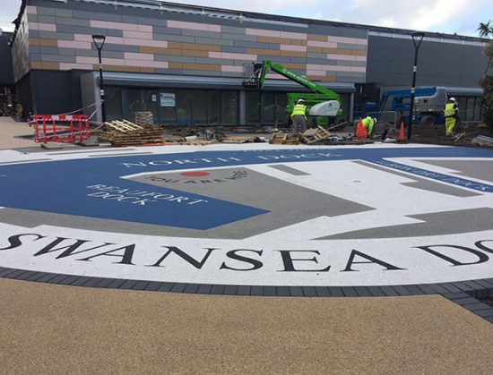 Resin bound colour way-finding graphic, Parc Tawe retail park Swansea