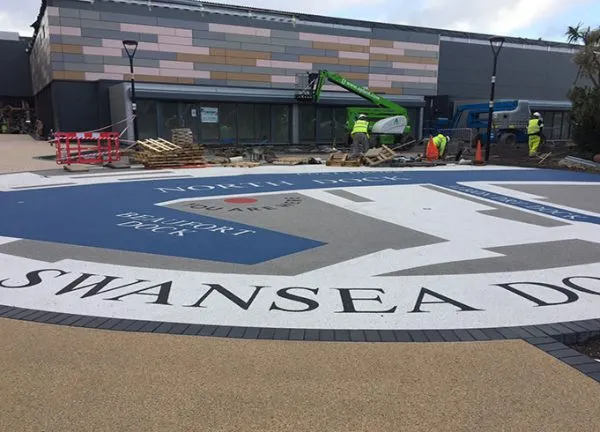 Resin bound colour way-finding graphic, Parc Tawe retail park Swansea