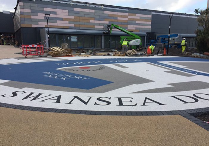 Resin bound colour way-finding graphic, Parc Tawe retail park Swansea