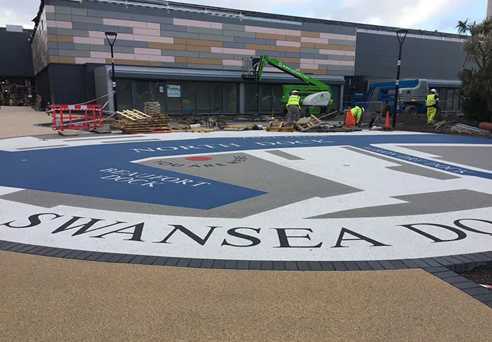 Resin bound colour way-finding graphic, Parc Tawe retail park Swansea