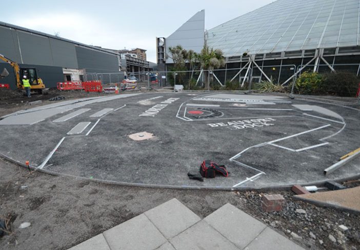 Resin bound colour way-finding dock side graphic, Parc Tawe retail park Swansea