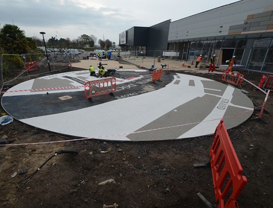 Resin bound colour way-finding dock side graphic, Parc Tawe retail park Swansea