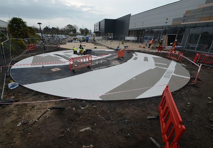 Resin bound colour way-finding dock side graphic, Parc Tawe retail park Swansea