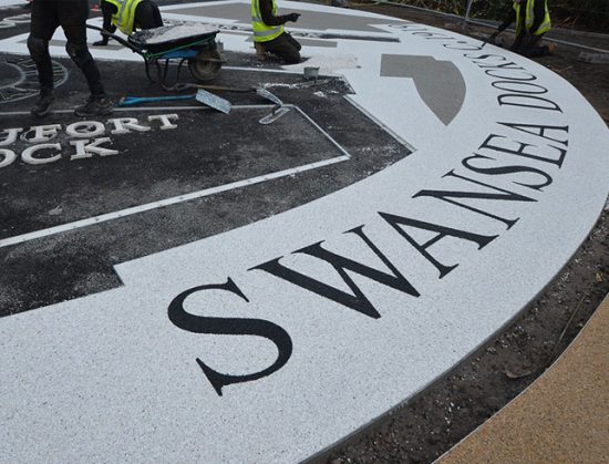Resin bound colour way-finding dock side graphic, Parc Tawe retail park Swansea