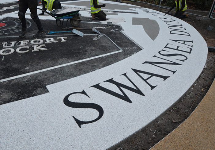 Resin bound colour way-finding dock side graphic, Parc Tawe retail park Swansea