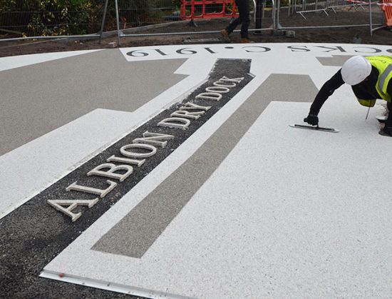 Resin bound colour way-finding dock side graphic, Parc Tawe retail park Swansea