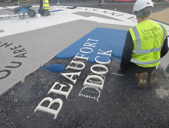 Resin bound colour way-finding dock side graphic, Parc Tawe retail park Swansea