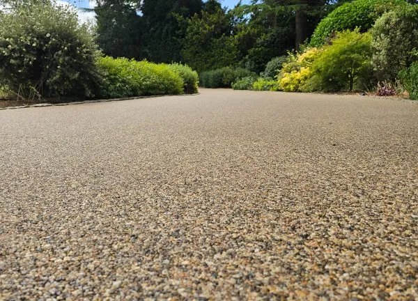 Resin bound driveway in country setting surrounded by trees