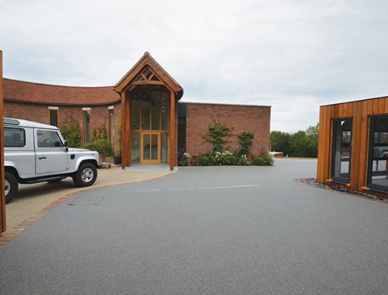 Resin bound drive for luxury garages A Room in My Garden Cuckfield, Sussex