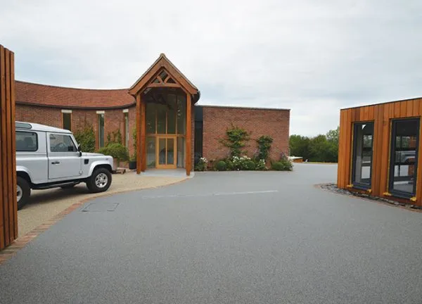Resin bound drive for luxury garages A Room in My Garden Cuckfield, Sussex
