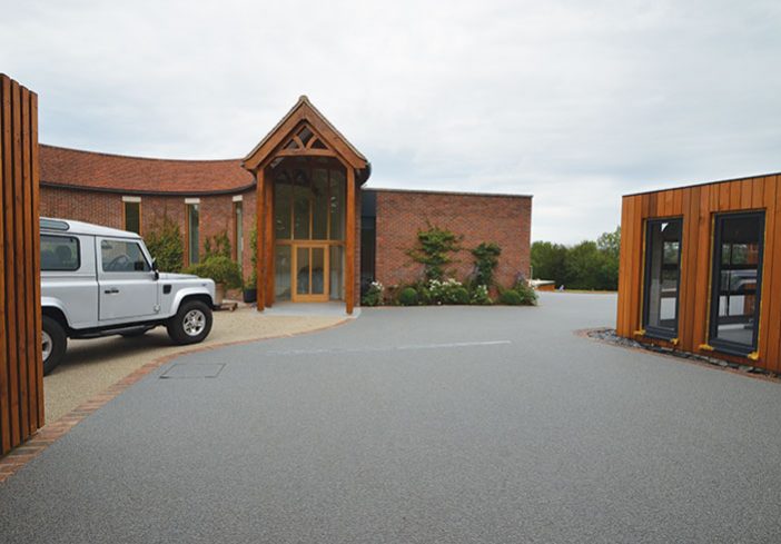 Resin bound drive for luxury garages A Room in My Garden Cuckfield, Sussex