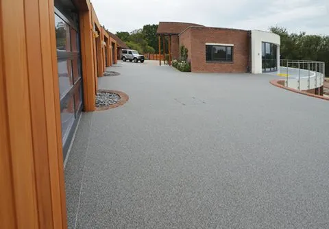 Resin bound drive for luxury garages A Room in My Garden Cuckfield, Sussex