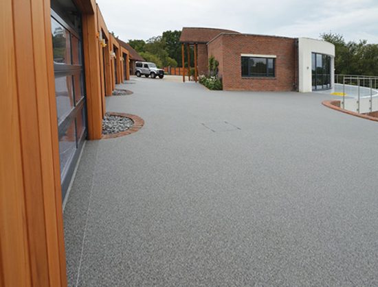 Resin bound drive for luxury garages A Room in My Garden Cuckfield, Sussex