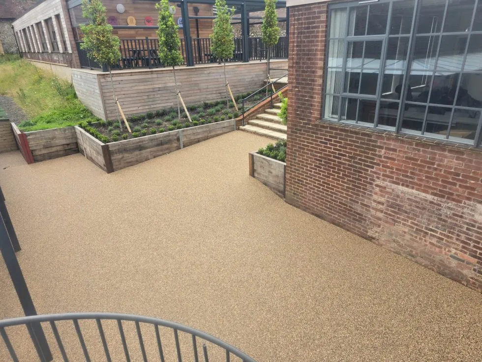 Resin bound driveway in a planted front garden - shows eco-friendly context