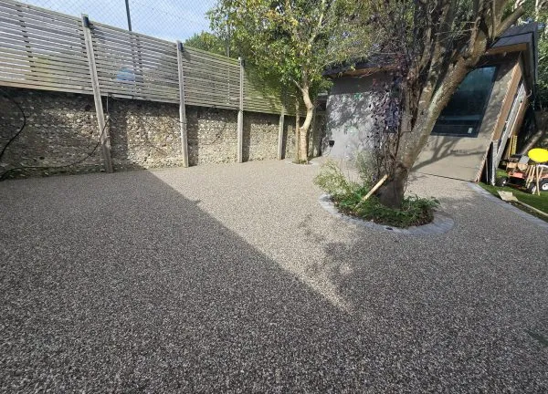 Resin bound terrace with outdoor furniture and planting