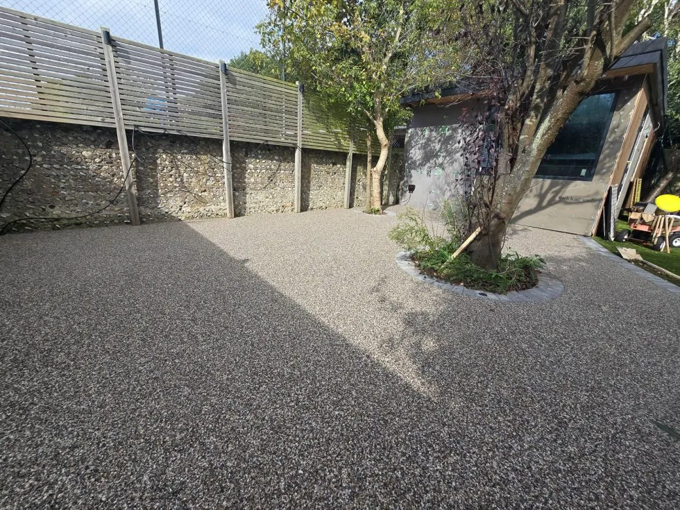 Resin bound terrace with outdoor furniture and planting