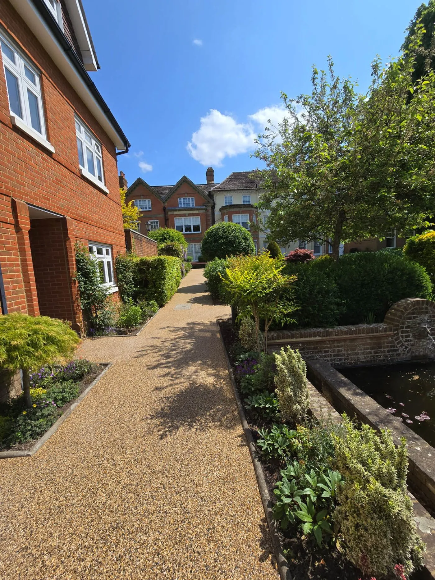 Resin bound permeable paving with planted front garden