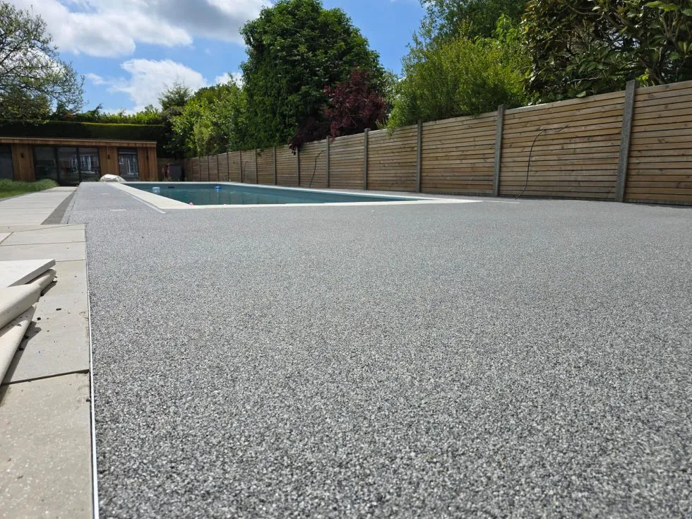 Resin surface surrounding swimming pool