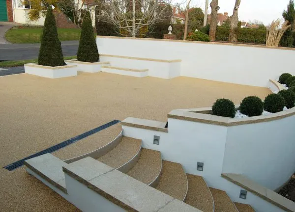 resin surface designed garden with steps access in Hove